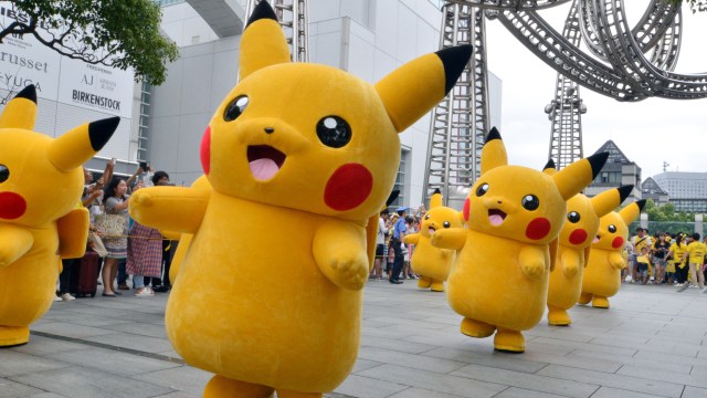 Dozens of Pikachu characters, the famous character of Nintendo's videogame software Pokemon, march at the Landmark Plaza shopping mall in Yokohama, suburban Tokyo on August 13, 2015. The Pikachu mascots walk around daily to attract summer vacationers as a part of the "Pikachu Outbreak" event through the weekend. AFP PHOTO / Yoshikazu TSUNO (Photo credit should read YOSHIKAZU TSUNO/AFP/Getty Images)